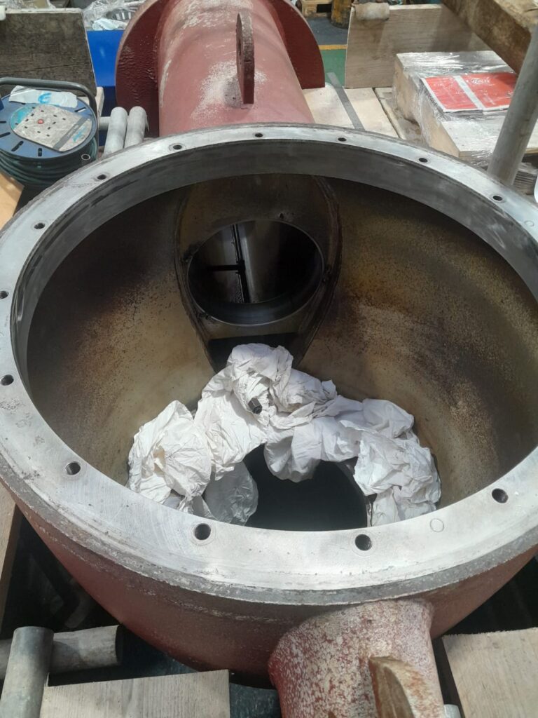 Internal view of marine engine housing after sleeve removal, prepared for precision line boring and new sleeve installation.