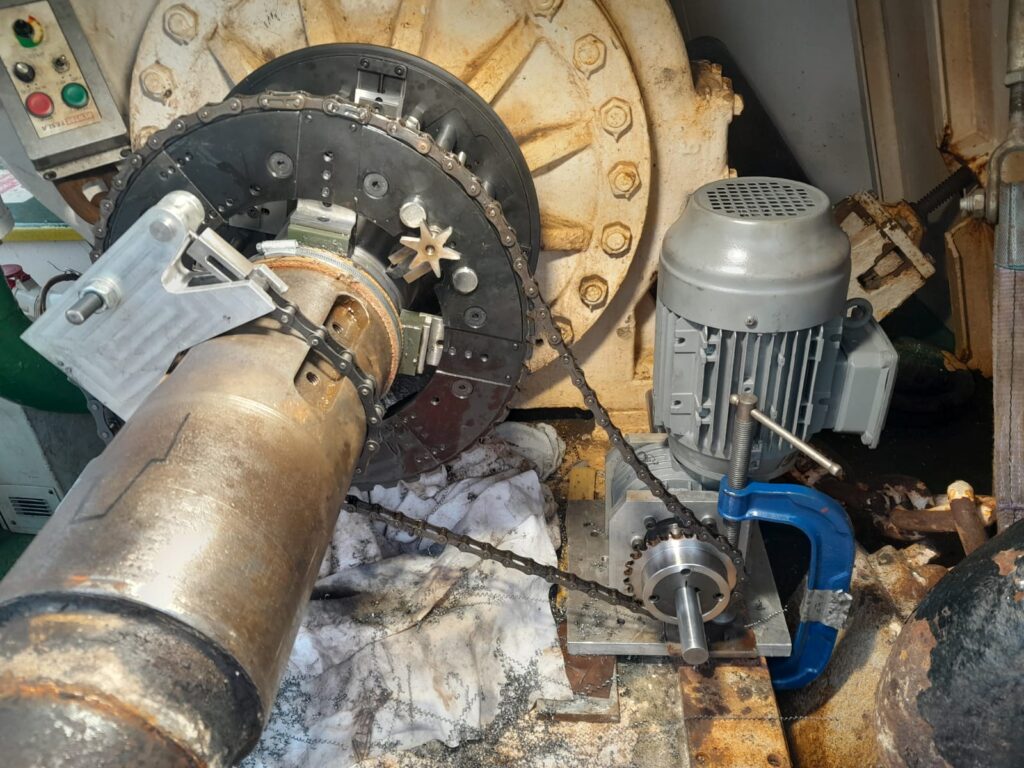Orbital machining tooling head set up on windlass shaft to maintain alignment during corrective onsite machining.